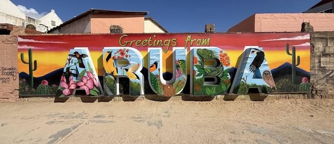 Greetings from Aruba postcard mural in San Nicolas